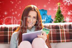 Composite image of woman shopping online