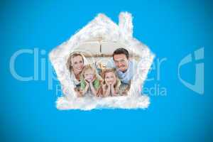 Composite image of happy family on the floor