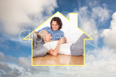 Composite image of young couple cuddling each other