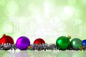 Composite image of christmas baubles and tinsel