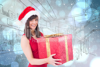 Composite image of festive brunette holding a gift