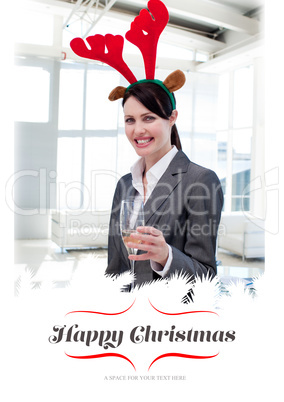 Composite image of smiling businesswoman with a novelty christma