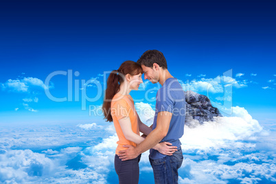 Composite image of couple looking at each other