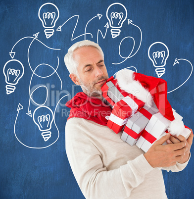 Composite image of happy festive man with gifts