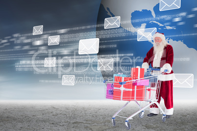 Composite image of santa delivering gifts from cart