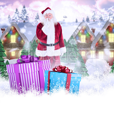 Composite image of santa asking for quiet to camera