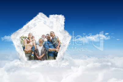 Composite image of cheerful extended family at park