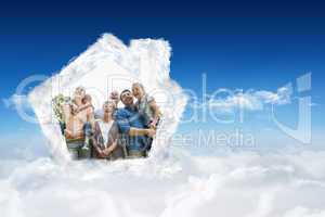 Composite image of cheerful extended family at park