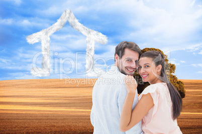 Composite image of attractive young couple smiling at camera