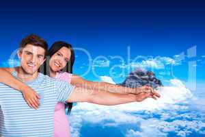 Composite image of young couple smiling at the camera