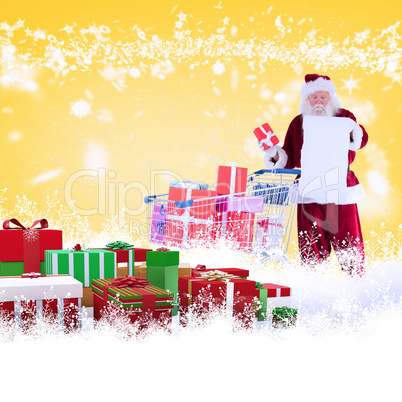 Composite image of santa spread presents with shopping cart