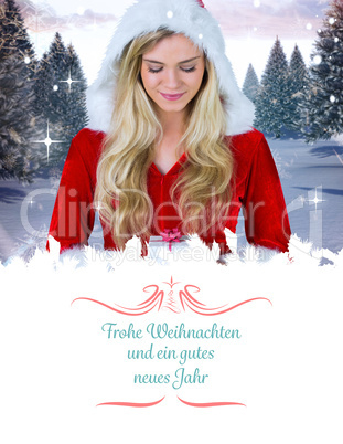 Composite image of pretty girl in santa outfit holding gift