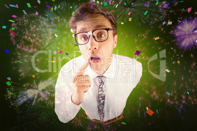 Composite image of young geeky businessman looking at camera