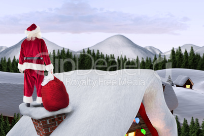 Composite image of santa on cottage roof