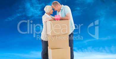 Composite image of older couple smiling at each other with movin