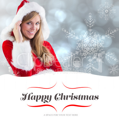 Composite image of festive blonde smiling at camera