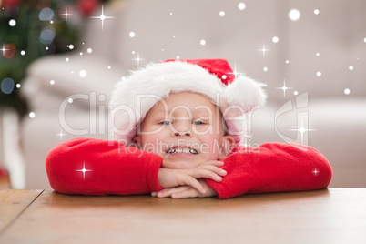 Composite image of festive little boy smiling at camera