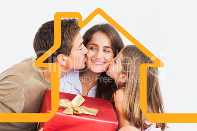 Composite image of father and his daughter offering a red gift