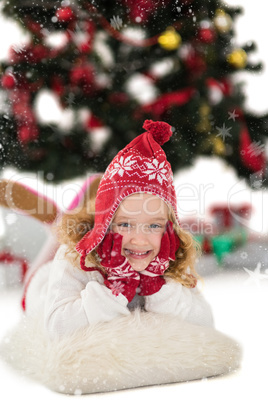 Composite image of festive little girl in hat and scarf