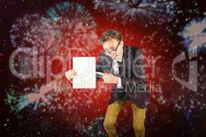 Composite image of young geeky businessman holding page