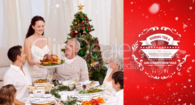 Composite image of woman showing turkey to her family for christ