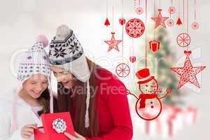 Composite image of mother and daughter with gift