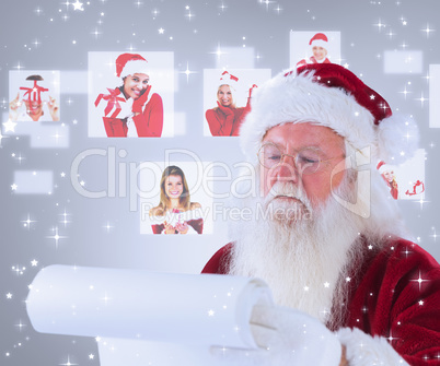 Composite image of santa claus reads a list