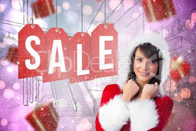 Composite image of cute brunette in santa claus smiling at camer