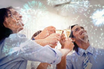 Composite image of cheerful business team toasting with champagn