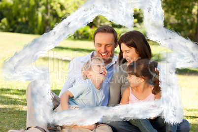 Composite image of family looking at their photo album in the pa