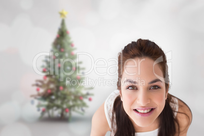 Composite image of happy brunette holding present with shoes