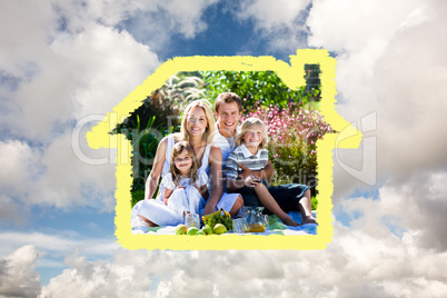 Composite image of cute family enjoying a picnic