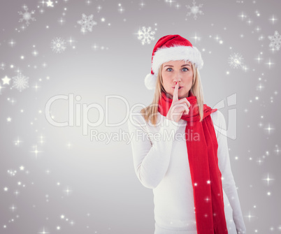 Composite image of festive blonde keeping a secret