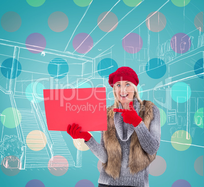 Composite image of blonde in winter clothes holding red sign