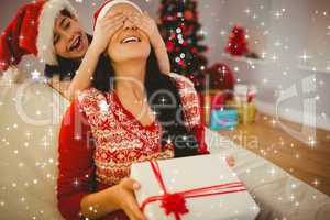 Composite image of daughter surprising her mother with christmas