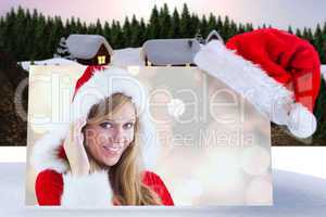 Composite image of festive blonde smiling at camera