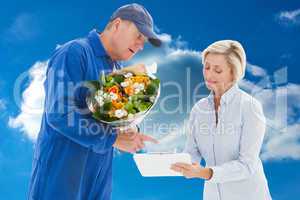 Composite image of happy flower delivery man with customer