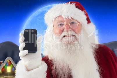 Composite image of santa claus shows a smartphone