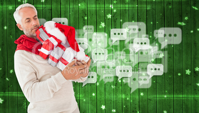 Composite image of happy festive man with gifts