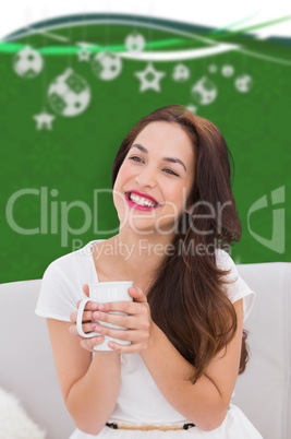 Composite image of woman holding a mug