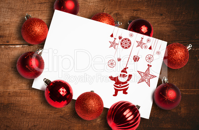 Composite image of hanging red christmas decorations