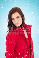 Composite image of portrait of a brunette in red coat posing