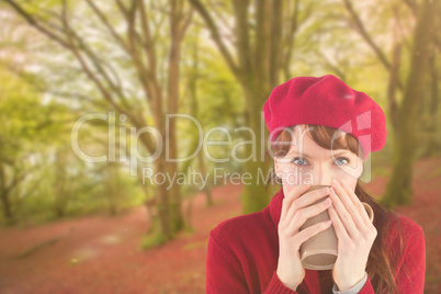 Composite image of woman drinking from a cup