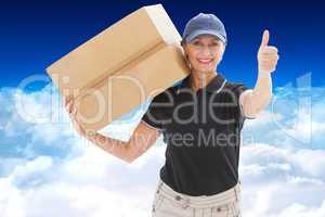 Composite image of happy delivery woman holding cardboard box