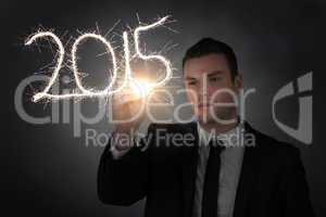 Composite image of businessman touching spark