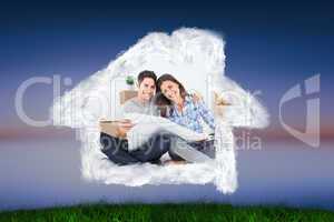 Composite image of man and woman holding house plans
