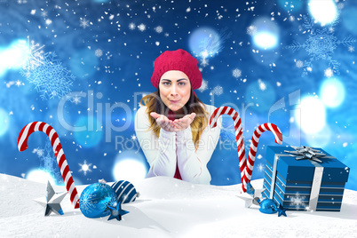 Composite image of brunette in winter clothes with hands out