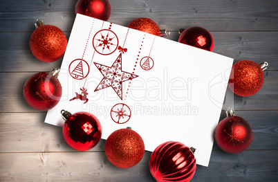 Composite image of hanging red christmas decorations