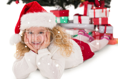 Composite image of festive little girl smiling at camera