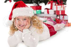 Composite image of festive little girl smiling at camera